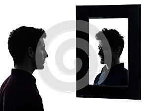 Man serious in front of his mirror silhouette