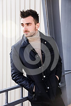 Man serious male model portrait blue jacket young guy gray background autumn winter black friday