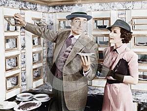 Man serving a dish to a woman in a Automat