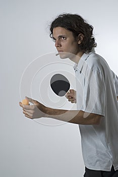 Man Serving Ping-pong Ball-Vertical