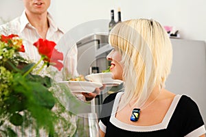 Man serving self cooked dishes photo