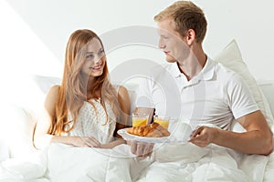 Man serving woman a breakfast