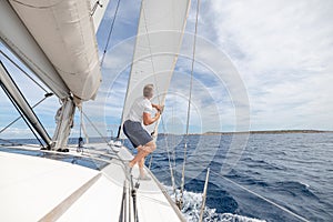 Man setting sail on his boat