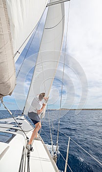 Man setting sail on his boat