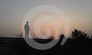 Man with setting sun