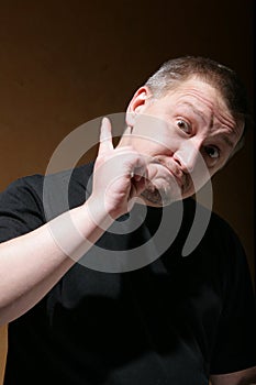 Man shake one's thumb