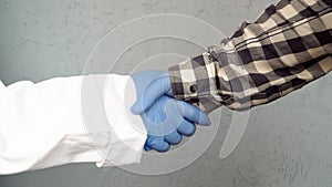 Man shakes hands with a doctor
