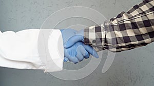 Man shakes hands with a doctor hands