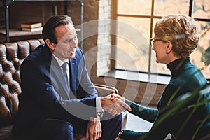 Man shaking hands with advisor photo