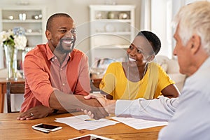 Man shaking hands with insurance agent