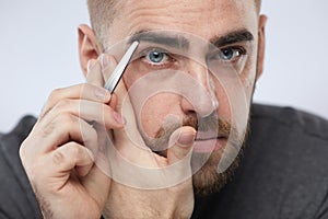 Man Shaping Eyebrows Portrait