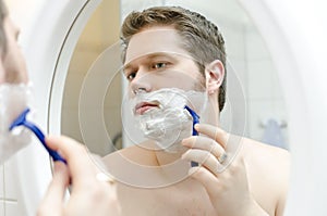 Man shaving.