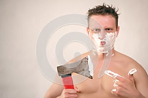 Man shaving by axe.