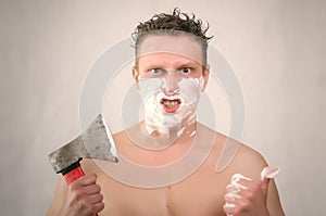 Man shaving by axe.