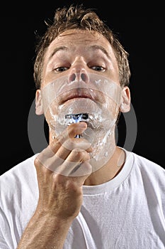 Man shaving chin