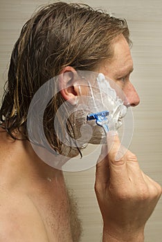 Man Shaving His Face