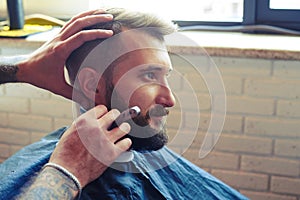 Man shaving with straight razor photo