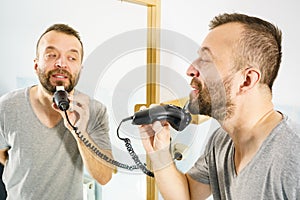 Man shaving trimming his beard