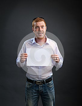 Man with a sheet of paper in his hands