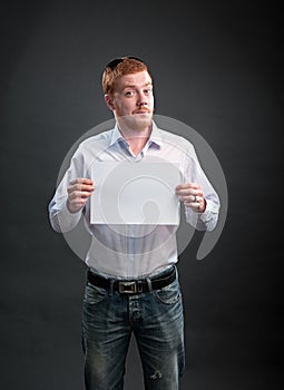 Man with a sheet of paper in his hands