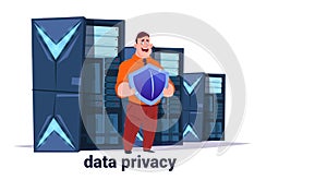 Man with shield on data storage center with hosting servers and staff. Computer technology, network and database
