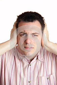 Man shielding his ears with hands