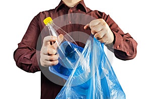 Man in shirt disposing plastic bottle and can