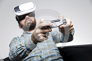 Man in shirt playing vr game with controller