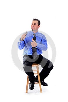 Man in shirt and tie speaking with a microphone