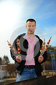 Man with a shish kebab photo