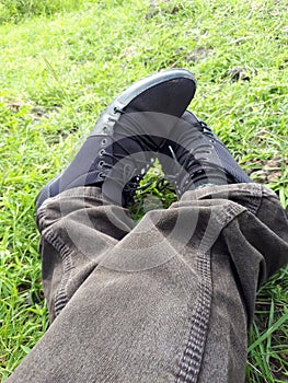 Man shoes in the Park,Canvas Shoes,Man Siting in the park