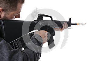 Man shooting from assault rifle on white background, closeup