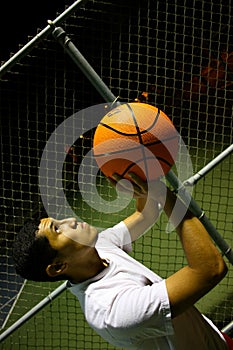 Man shooting basketball