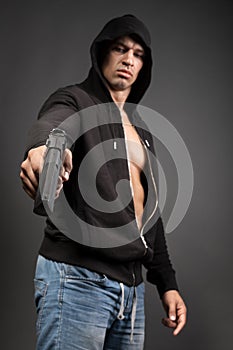Man shooting gun isolated on gray background