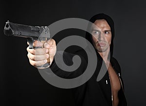 Man shooting gun isolated on gray background