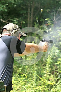 Man Shooting Pistol - Sideview