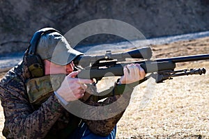 Man Shooting Rifle