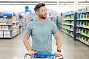 Man in shop, market store. Man shopping in supermarket. Sales, shop and shopping. Guy in market. Shopping market