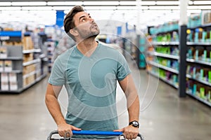 Man in shop, market store. Man shopping in supermarket. Sales, shop and shopping. Guy in shop market. Shopping center