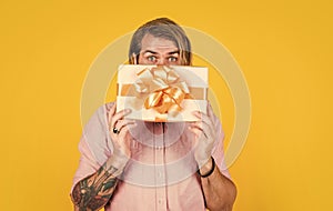 Man in shop. the package delivery. human emotion and facial expression. bearded man gift holiday decoration. businessman