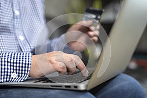 A man shopping online via credit cards.Business and Technology Concepts