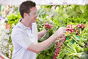 Man shopping in produce department