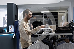 Man shopping for trendy menswear photo