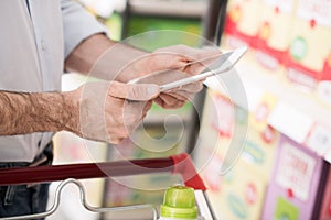 Man shopping and using a tablet