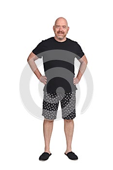 Man in short pant pajamas on white background,hands on hip