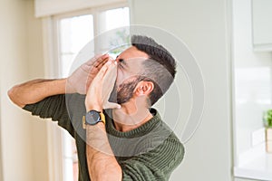 Man shouting with rage covering mouth with hands, yelling frustrated and crazy