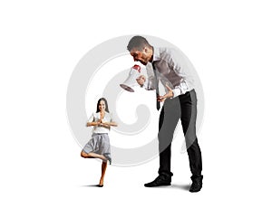 Man shouting at small calm woman