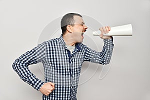 Man shouts into a handmade loudspeaker