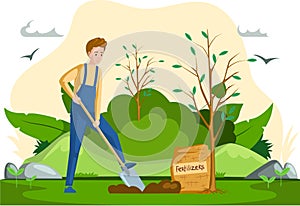 Man with shovel digging hole in garden. Gardener buries seedling in ground, applies fertilizer