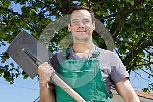 man with shovel in garden